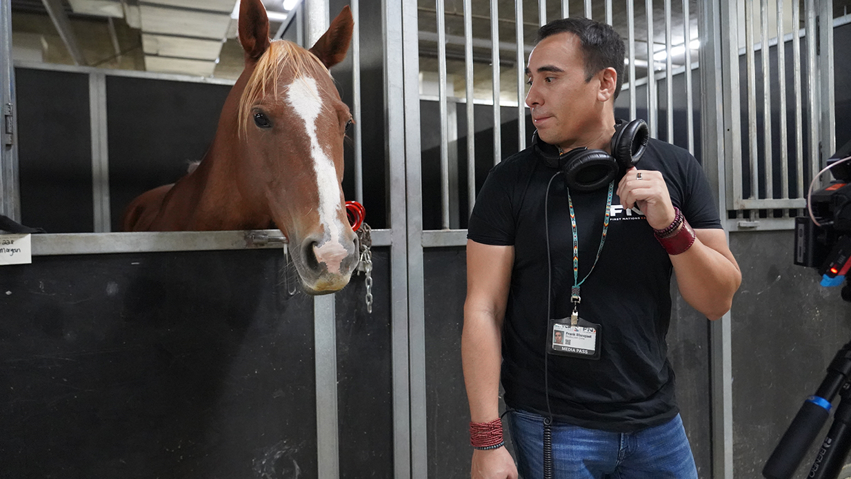 Frank Blanquet standing next to a horse